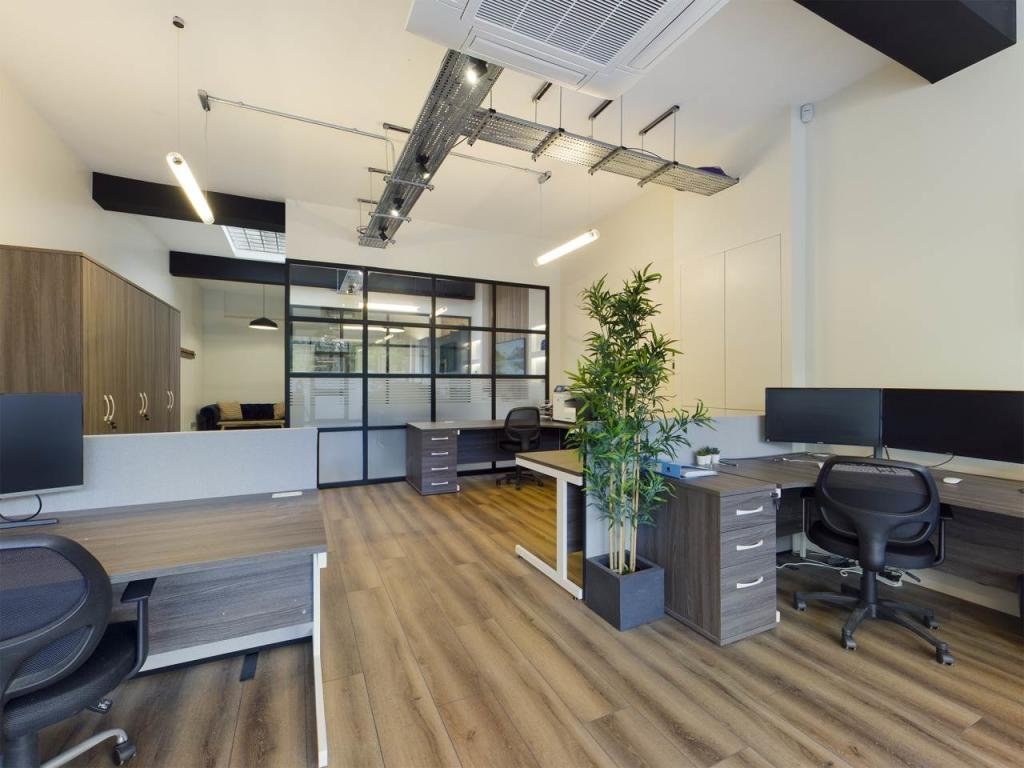 Workspace with glazed meeting room beyond